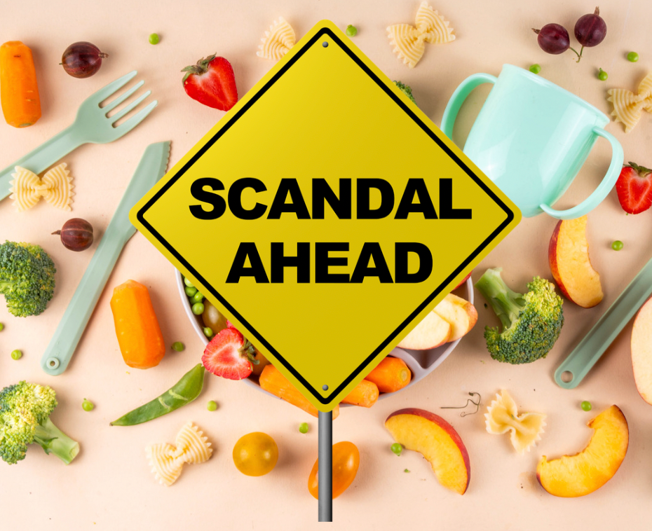 Fruits vegetables and baby food are in the background with a yellow traffic-looking sign saying "scandal ahead" on top of the food visual