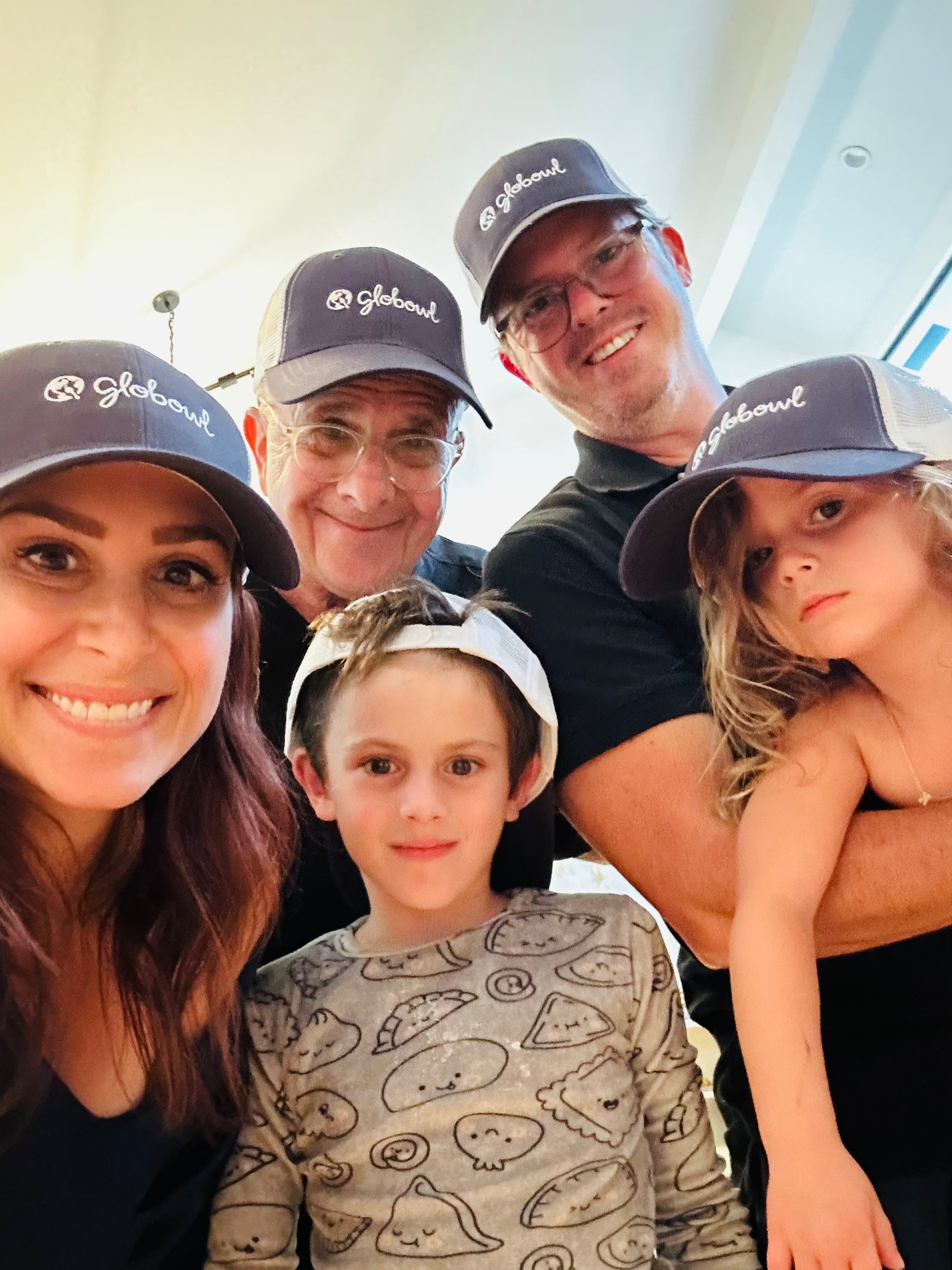 Founder Erica and her whole family wearing Globowl brand caps